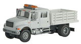 Walthers 949-11894 International 4900 Open Stake Bed Utility Truck White w/Railroad Maintenance-of-Way Logo Decals - Assembled HO Scale SceneMaster